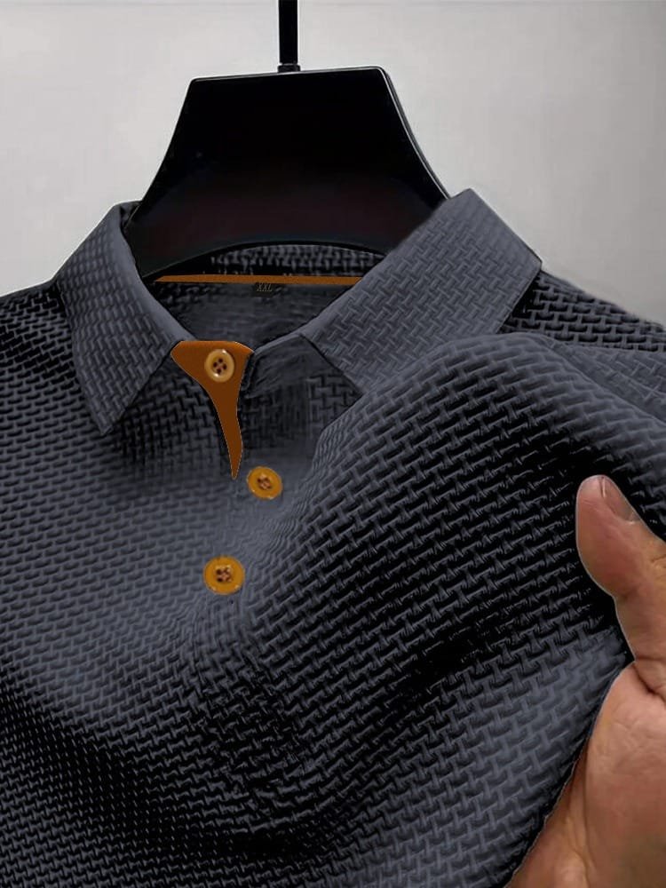 Men's waffle knit polo top in dark grey, close-up of the collar, button placket and waffle texture