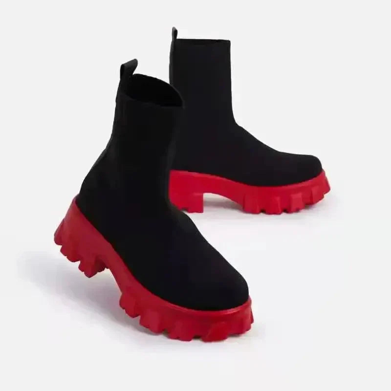 Women's black and red chunky sole ankle boots with lugged tread