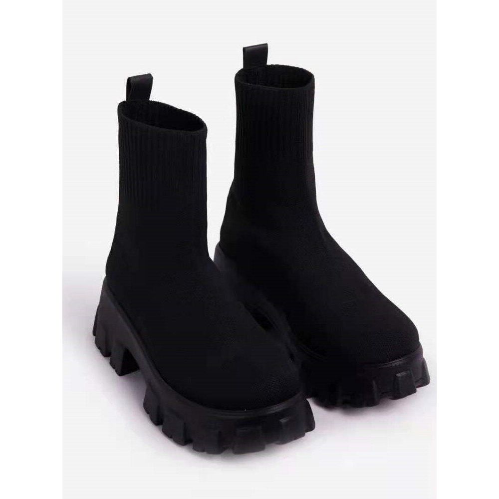 Women's black chunky sole ankle boots with lugged tread