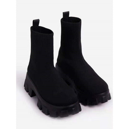 Women's black chunky sole ankle boots with lugged tread