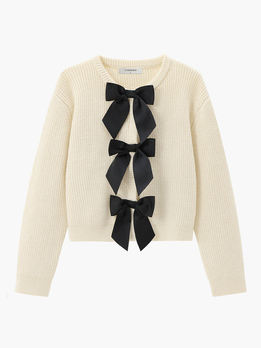 Women's ivory ribbed open-front cardigan with three black satin bow ties